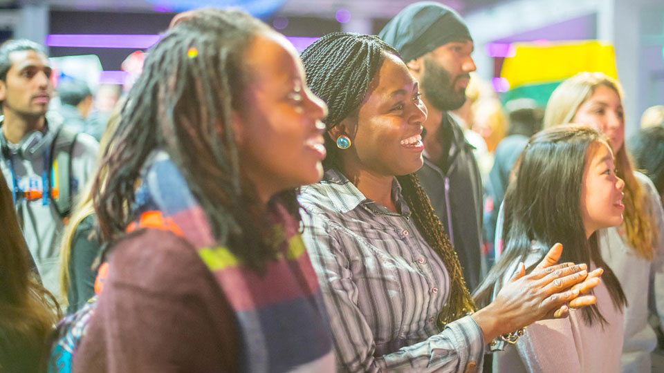 Two students smiling together at the Loughborough Students' Union